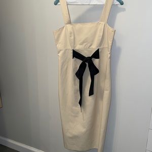 Beige Mini Dress with Black Bow Accent